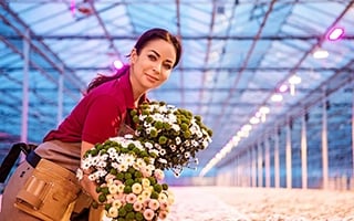grower-front-view-woman-holding-flowers